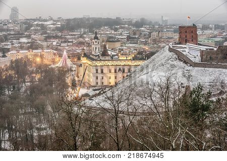 Vilnius, Lithuania: aerial view of the old town,  christmas tree and decorations in Cathedral Square at sunset