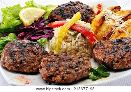 Greek Burger Plate	with rice and fried potatoes