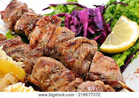 Greek Souvlaki with rice and fried potatoes