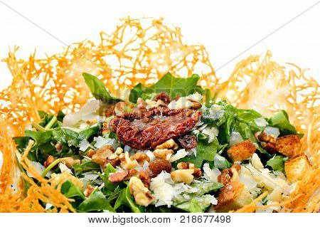 Rocca Salad with dried tomato in cheese bowl
