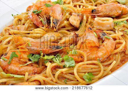 Pastas with shrimps squids and tomato sauce