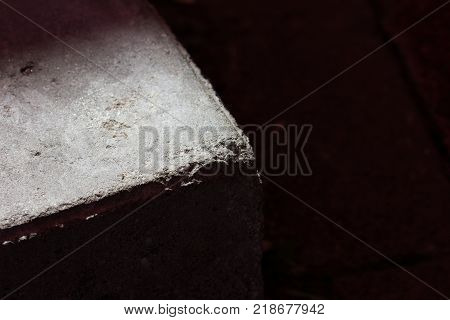 stone in the shade.  