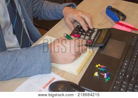 Concept of accountant's work. Planning budget audit and Business concept. Businesspersons analyzing report. Young Business people Calculating Finance Bills In Office. Businessperson working in office