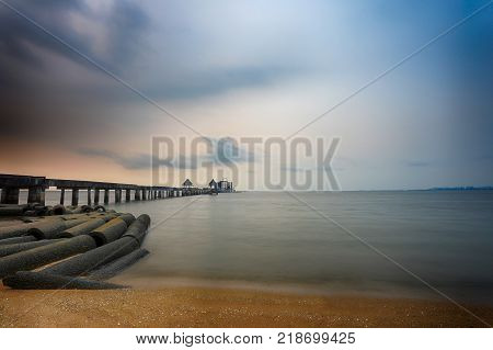 Old bridge in the sea on twilight time after sunsetnature of outdoor tropical coast in Thailand  