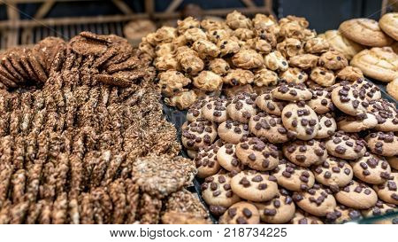 Assortment of homemade chocolate chip cookies on a pastery window