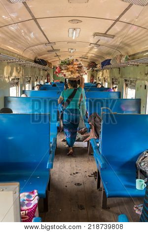 Mandalay, Myanmar - October 4, 2016: Unidentified burmese woman selling snacks in the train between Mandalay and Hsipaw in Myanmar