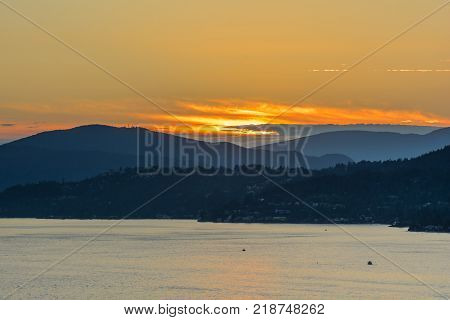 Sunset with Sea and Mountain View. Lions Gate Bridge Sunset and evening in Vancouver Canada.