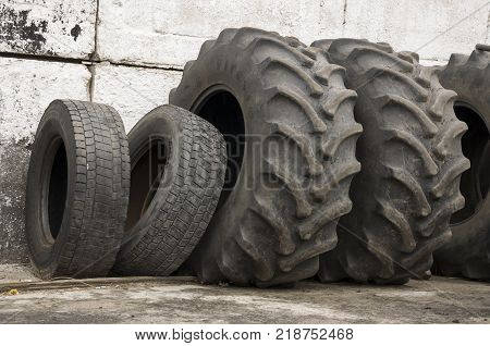 Service station for cars. Old tires on the yard