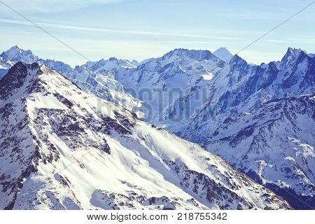 Beautiful snow tops of the mountains of the Great Caucasus Range. Ski resort of Elbrus.