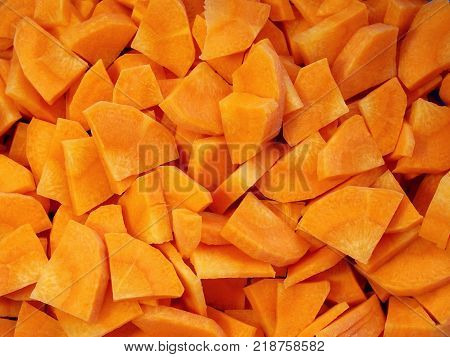 Fresh juicy sliced carrots. Straight slices. Bright orange color. The structure of the plant is visible. A delicious vegetable. Healthy food. Many vitamins.