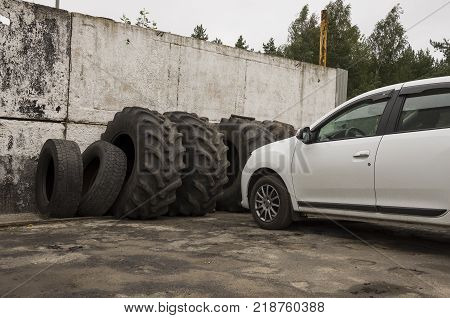 Service station for cars. Old tires on the yard