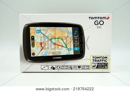 Amsterdam, The Netherlands-  December 17, 2017: TomTom Go GPS Car navigation system retail box against a white background.
