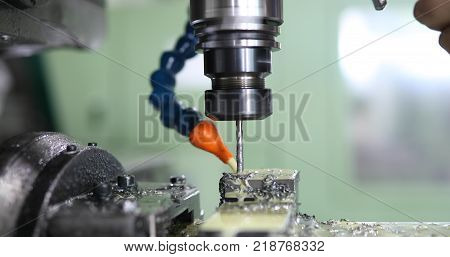 Milling cutting metalworking process. Precision industrial CNC machining of metal detail
