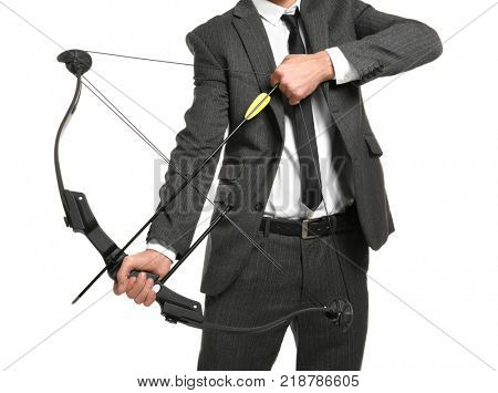Businessman practicing archery on white background