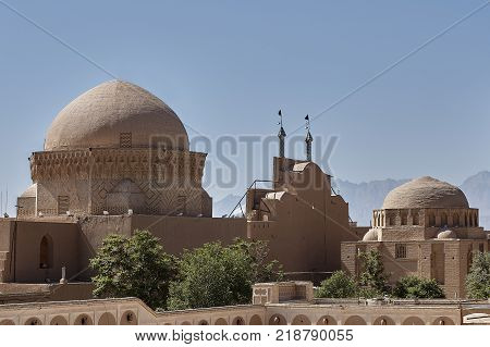 Ancient center of Yazd town in Iran mud brick architecture Friday mosque and traditional old bazaar.
