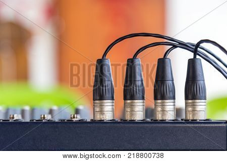 The XLR connectors on the audio mixers.