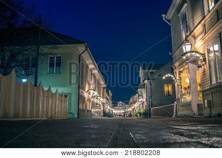 Vadstena Sweden- December 16 2017: Christmas ornaments and light by Storgatan street witch is a pedestrian zone