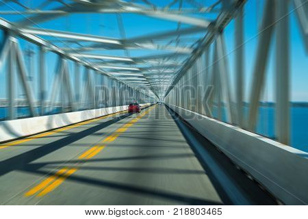Highway bridge tunnel over water with motion blur concept
