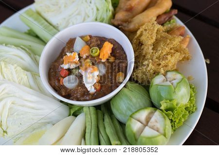 Thai food name Naam Prik Long Rau Shrimp paste sauce with crispy fried fish and sweet pork