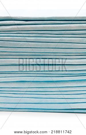 Stack Of Disposable Bed Pads Isolated On White