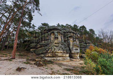 Sculptures Devil's heads in the village Zelizy - Czech republic - travel and architecture background