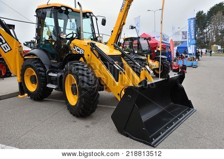 VILNIUS LITHUANIA - APRIL 27: JCB heavy duty equipment vehicle and logo on April 27 2017 in Vilnius Lithuania. JCB corporation is manufacturing equipment for construction and agriculture.