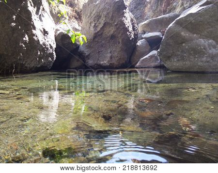 stone walls on the river the water so clear