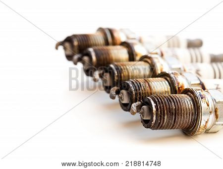 Heavily Worn Spark Plugs Isolated On White