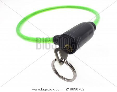 Green bike cable lock with key isolated on white background