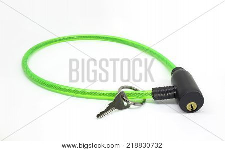 Green bike cable lock with key isolated on white background
