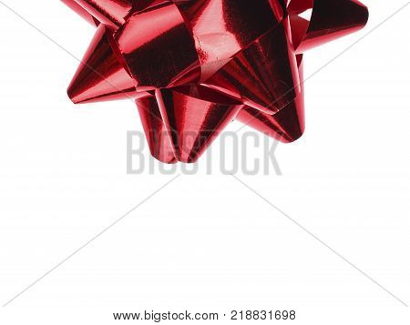 A holiday symbol, an element of decor. Red bow isolated on white background.
