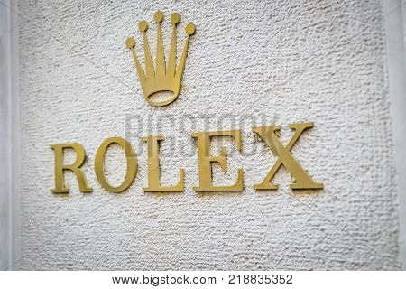 Milan Italy - September 24 2017: Rolex logo in a store in Milan. Fashion week Rolex shopping