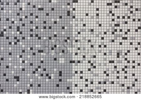 Decorative gray, white and black mosaic tiles background.