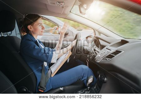 A woman feels stress on the road. Big Traffic jams. Business woman is late for work.