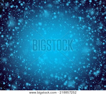 Night blue winter background with blue snowflakes.