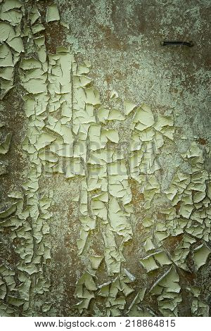 Vintage and grunge green wall with peelled paint