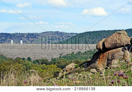 View of dam wall and rock filled embankment of Wyangala Dam from the surrounding hills in the Lachlan River Valley, near Cowra, central west region, of New South Wales, Australia