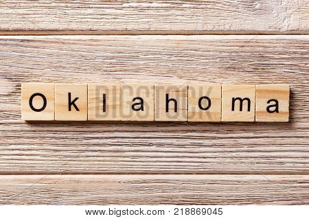 Oklahoma word written on wood block. Oklahoma text on table concept.