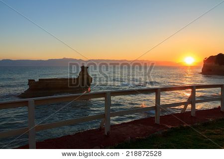 Rocks on the beach in the morning sunrise Corfu in Greece