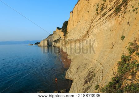 Rocks on the beach in the sunset on Corfu in Greece