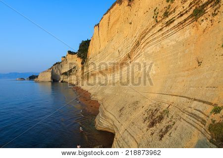 Rocks on the beach in the sunset on Corfu in Greece