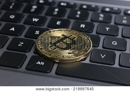 bitcoin on laptop keyboard exchage crypto currency mining