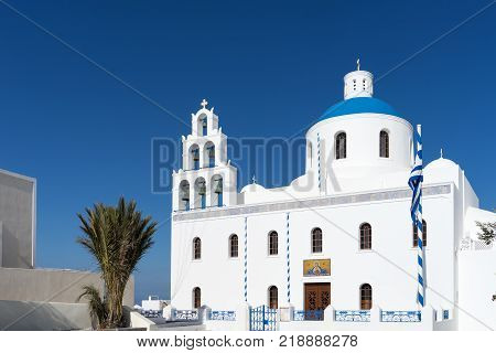 White blue orthodox church of Panagia Platsani, in the village of Oia. Santorini