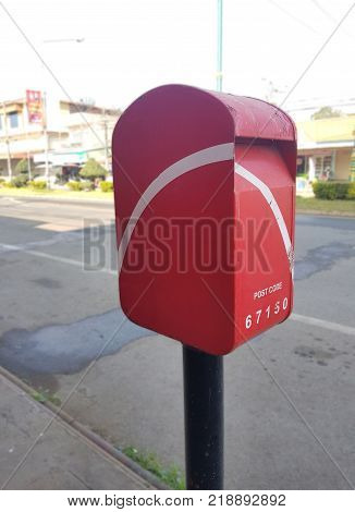 Vintage Thai Postbox Red.red Thai Mailbox On The Corner Of A Street