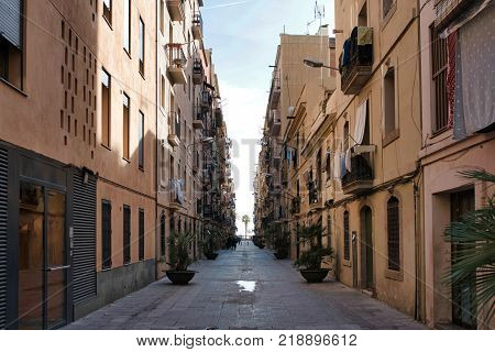 narrow alley in Barceloneta neighborhood in Barcelona