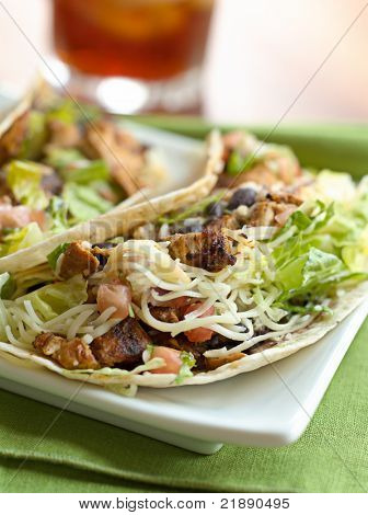 closeup photo of a place of soft shells tacos shot with selective focus