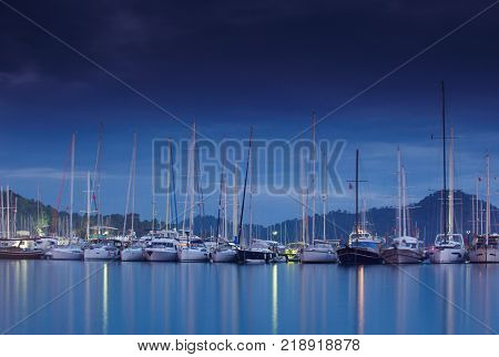 marina at night with moored yachts in Gocek Turkey