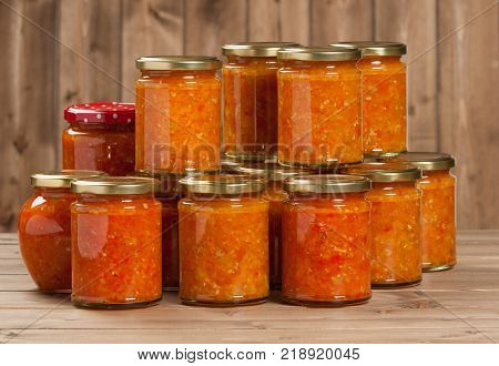Homemade Preserve With Sweet And Hot Peppers, Tomatoes, Garlic, Carrots. Traditional Adjika Dip