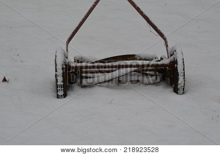 An old antique push reel type mower