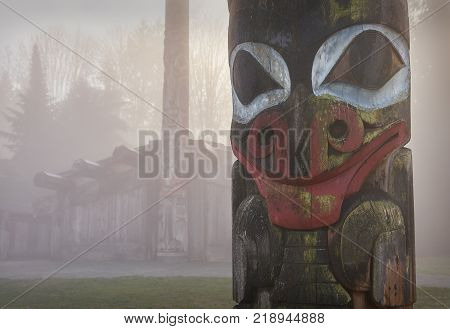 Totem In Mist.

Totem In Front Of A Longhouse In The Morning Mist.
